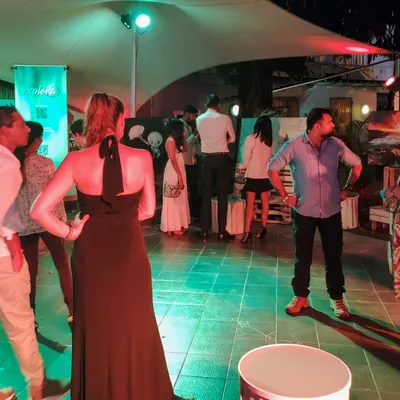 Photo exhibition at night in a restaurant in Flic en Flac