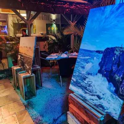 Photo exhibition at night in Twins Garden restaurant at Flic en Flac