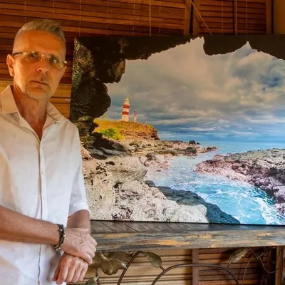 Arthur Movsisyan and his lighthouse photo during photo exhibition in Albion