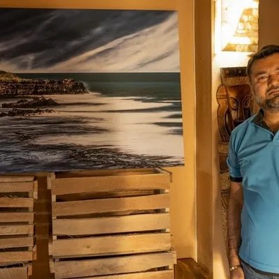 Tapan Gandhi and his photo taken at Gris Gris during photo exhibition at Les Robinsons
