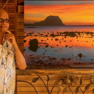Désiré Lilyman and his reflection photo taken at Le Morne during photo exhibition