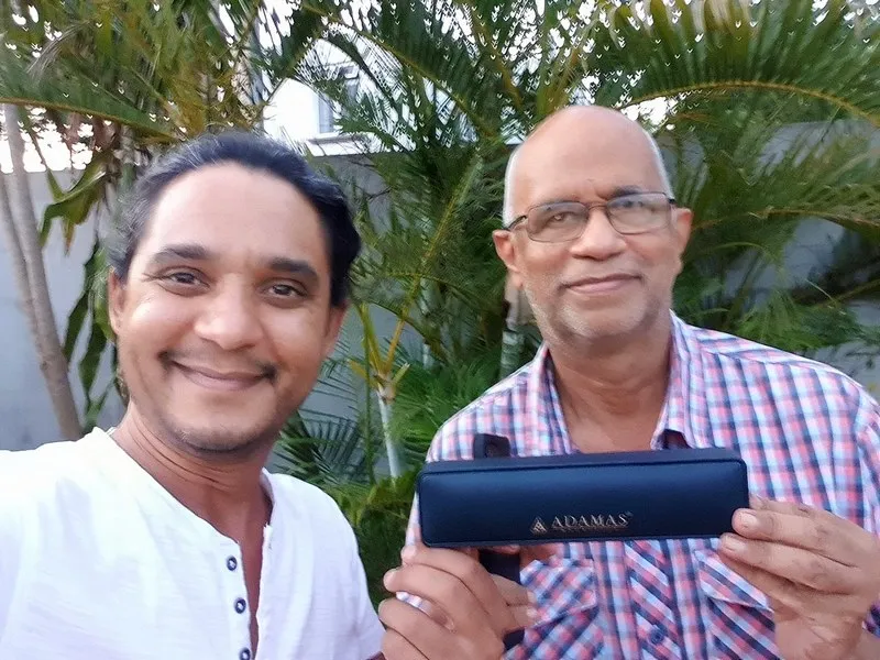 Photo Contest #02 Winner – Amazing Sunset Winner of Photo Contest Amazing Sunset receiving prize from Kurt Francois of Explora in Albion Mauritius