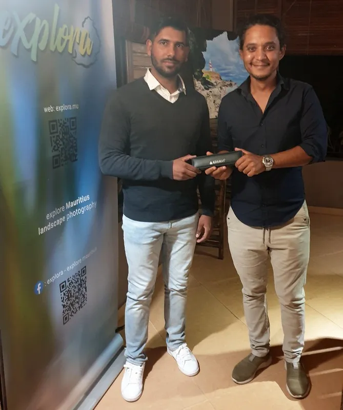 Winner of Photo Contest Aerial Photography receiving prize from Kurt Francois of Explora at Les Robinsons restaurant in Albion Mauritius