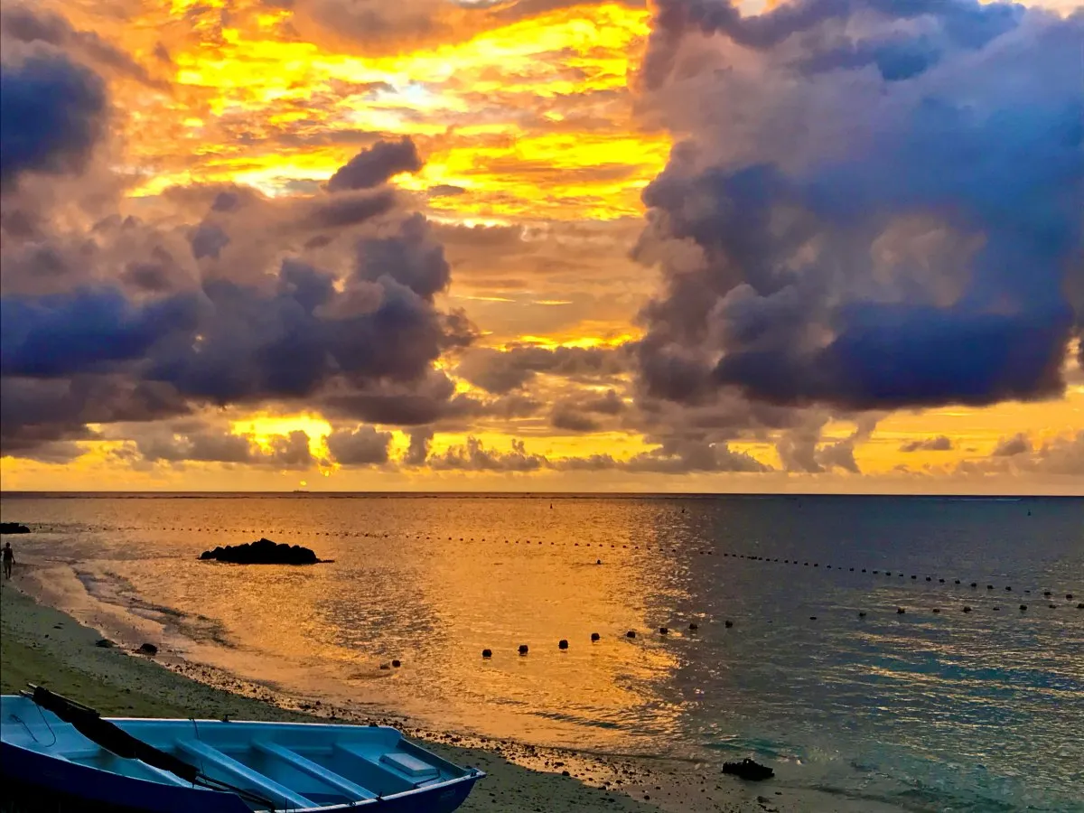 Dramatic sunset with clouds over Trou aux Biches lagoon and beach in Mauritius