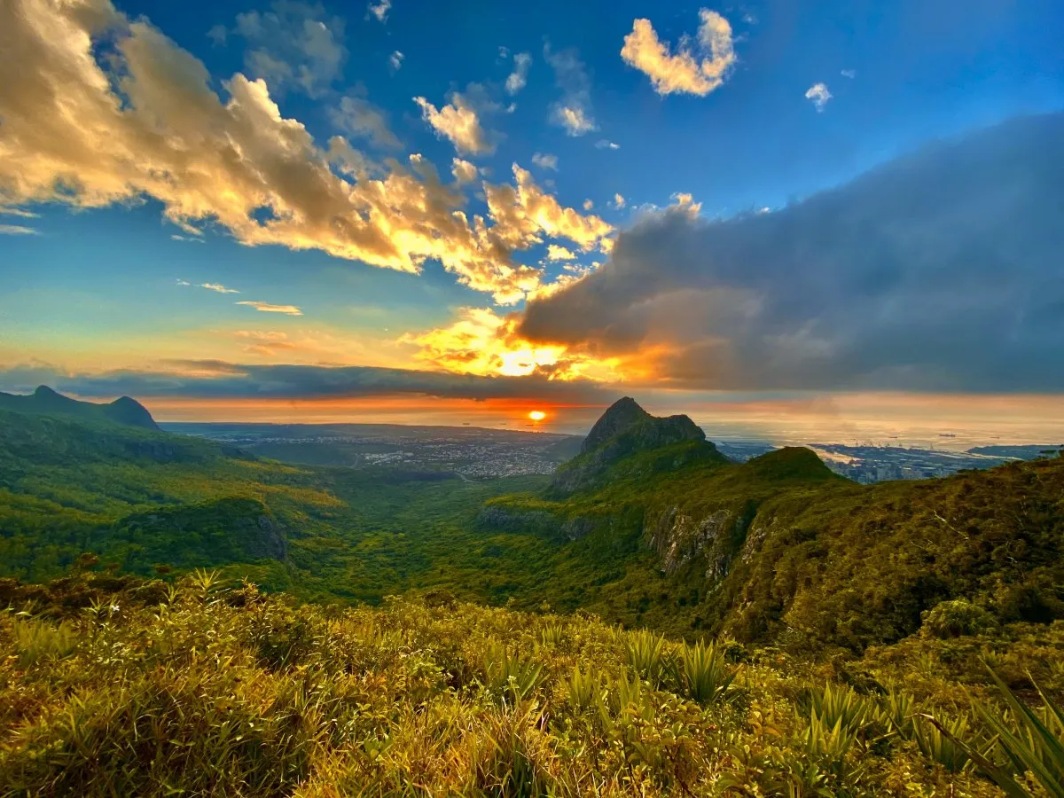 Sunset over Le Pouce Mountain with clouds and plants in Mauritius