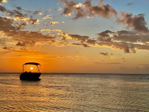 Sunset view through boat at Trou aux Biches