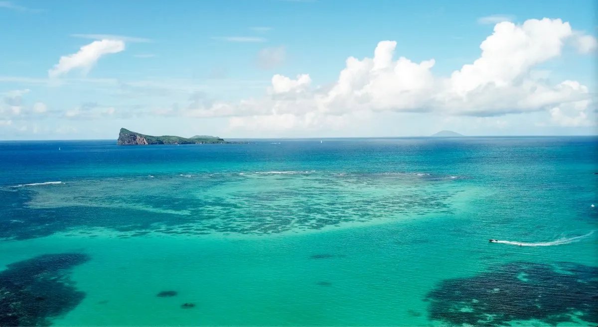 Aerial drone photo of Coin de Mire island and turquoise lagoon in northern Mauritius