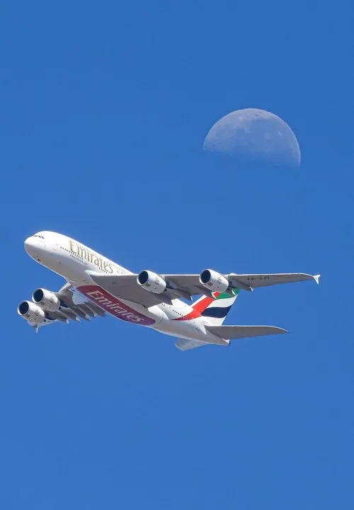 Aircraft passing by the moon in Mauritius