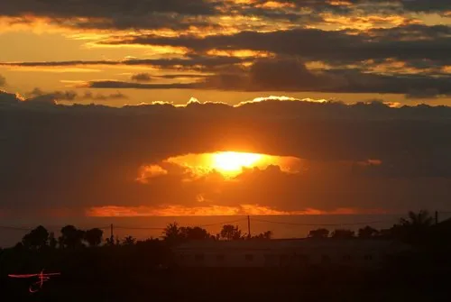 Mahebourg Sunrise behind clouds over the sea