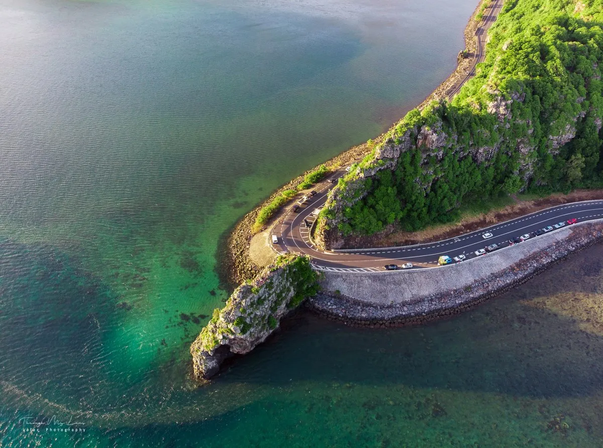 Aerial view of Macondé’s scenic coastal road in Mauritius with lush landscape and ocean views