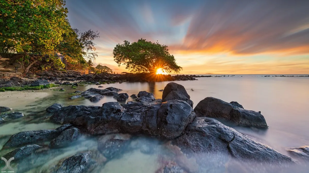 Long exposure capture of sunset and beach with clouds at Mont Choisy in Mauritius