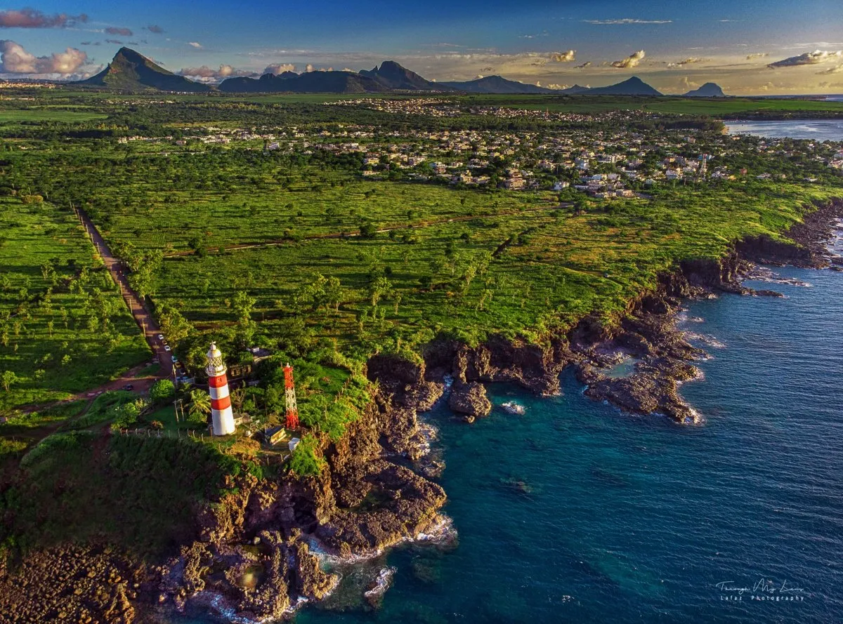 Aerial view of Albion Pointe aux Caves lighthouse and rugged cliffs in Mauritius