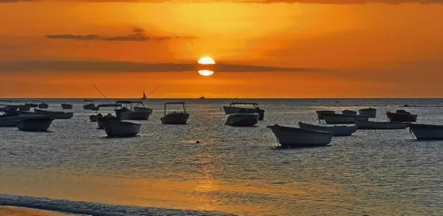 Sunset cut in half by clouds at Tamarin Bay