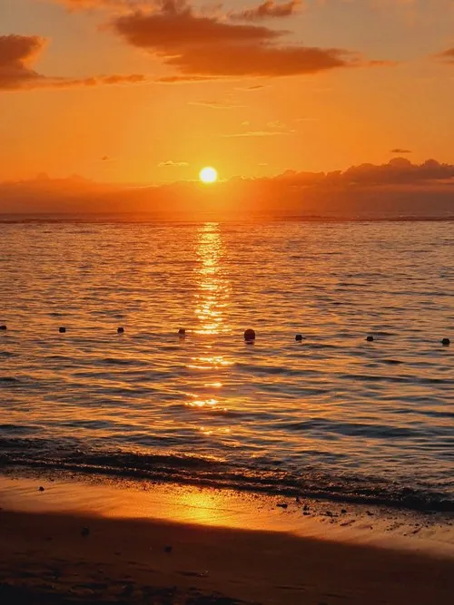 Sunset reflection in the ocean at Flic en Flac