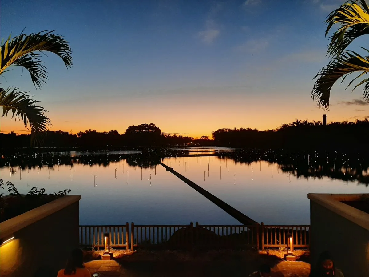 Sunset view of Mahogany Shopping Promenade and lake at Pamplemousses in Mauritius