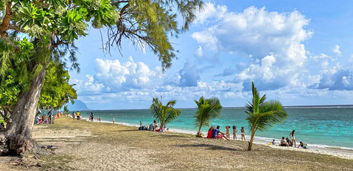 Mauritian picnic setup under trees at Flic en Flac Beach with cloudy weather in Mauritius