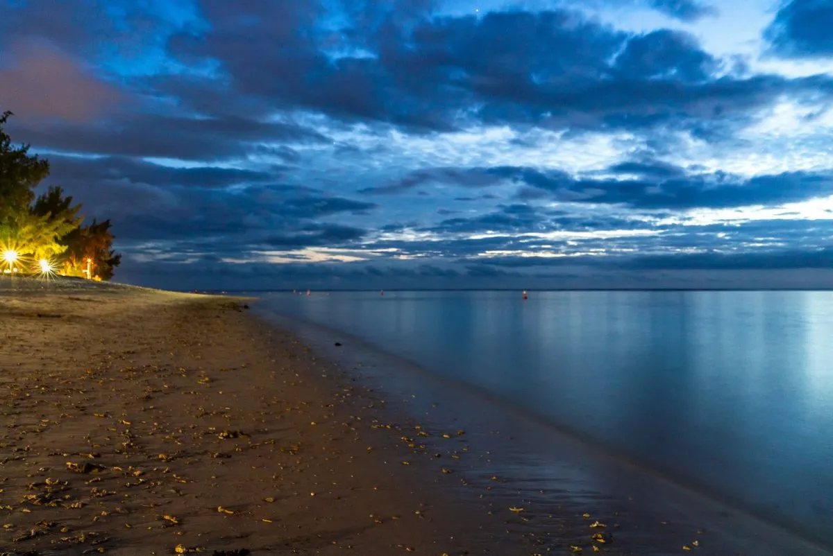 Long exposure night seascape of Flic en Flac beach with clouds over Mauritius