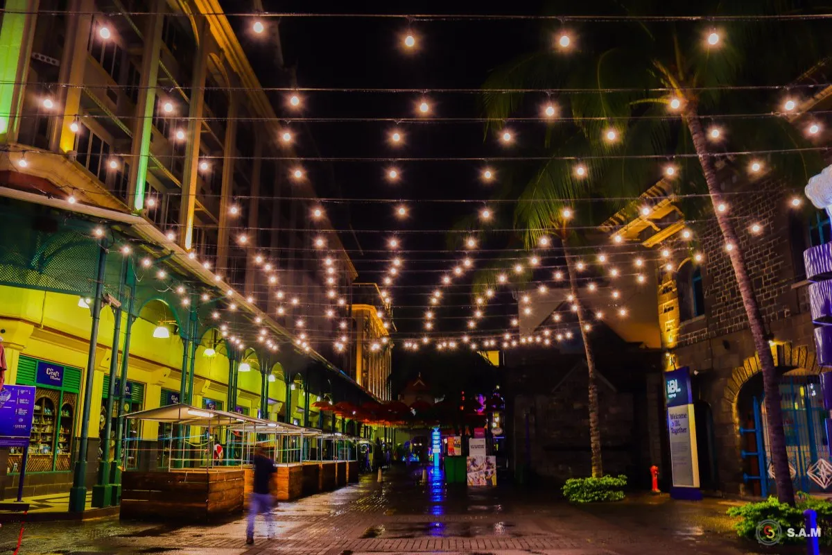 Festive light decorations illuminating Caudan Waterfront at night in Mauritius