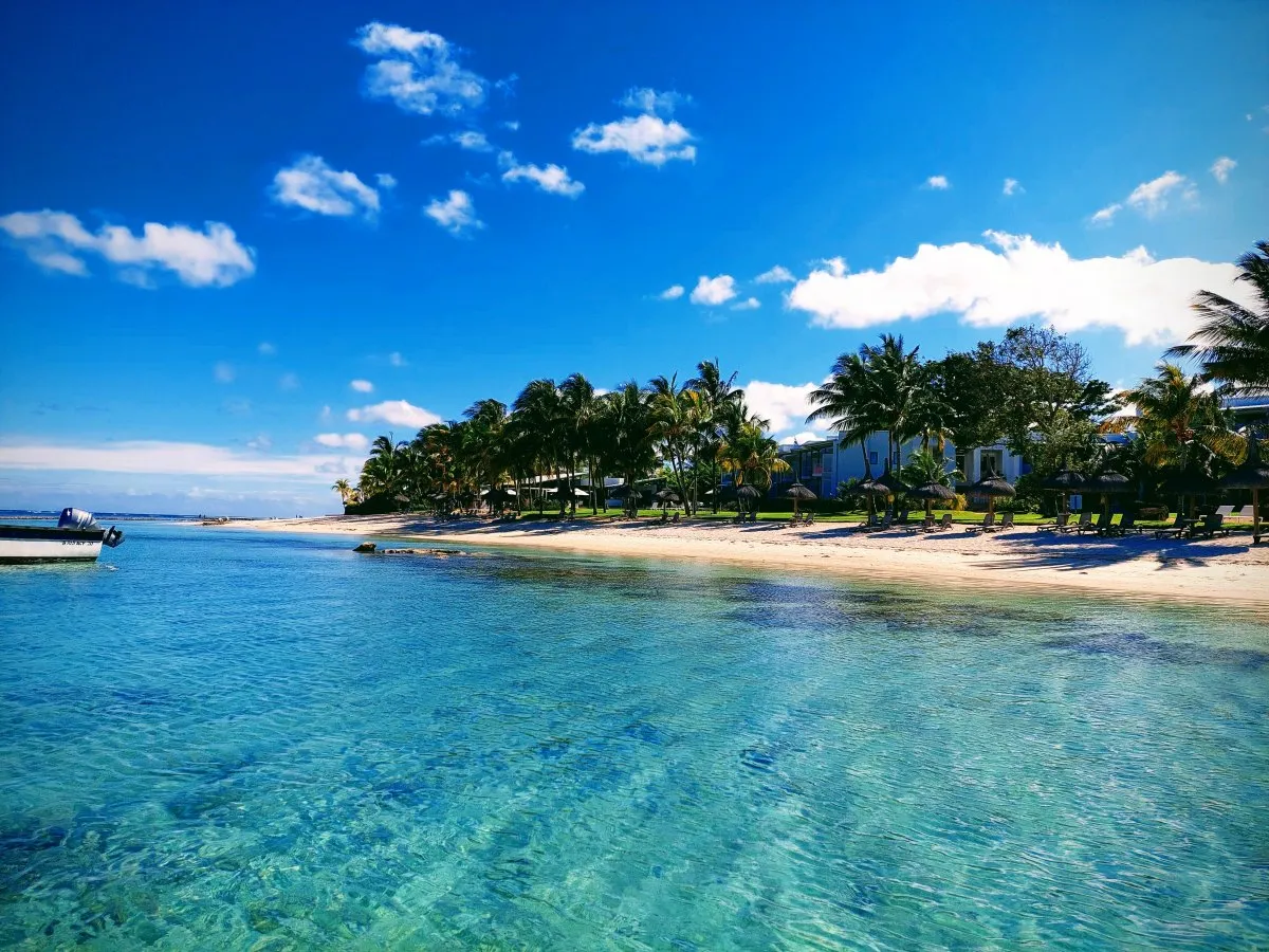 Turquoise lagoon and white sandy beach at Ilot Gabriel Island in Mauritius