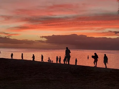 Silhouette of Mauritian people at Flic en Flac beach