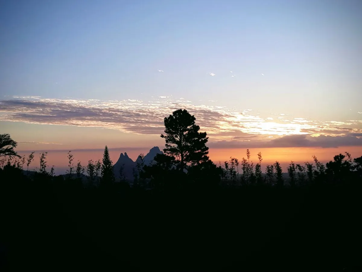 Silhouette of trees and landscape during sunset at Trou Aux Cerfs crater in Mauritius