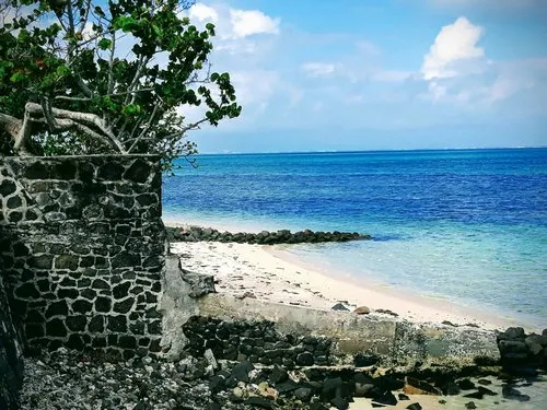 Collapsed wall at Pointe d'Esny beach in Mahebourg