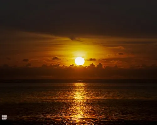 Reflection of sunset & golden sky at Wolmar Beach