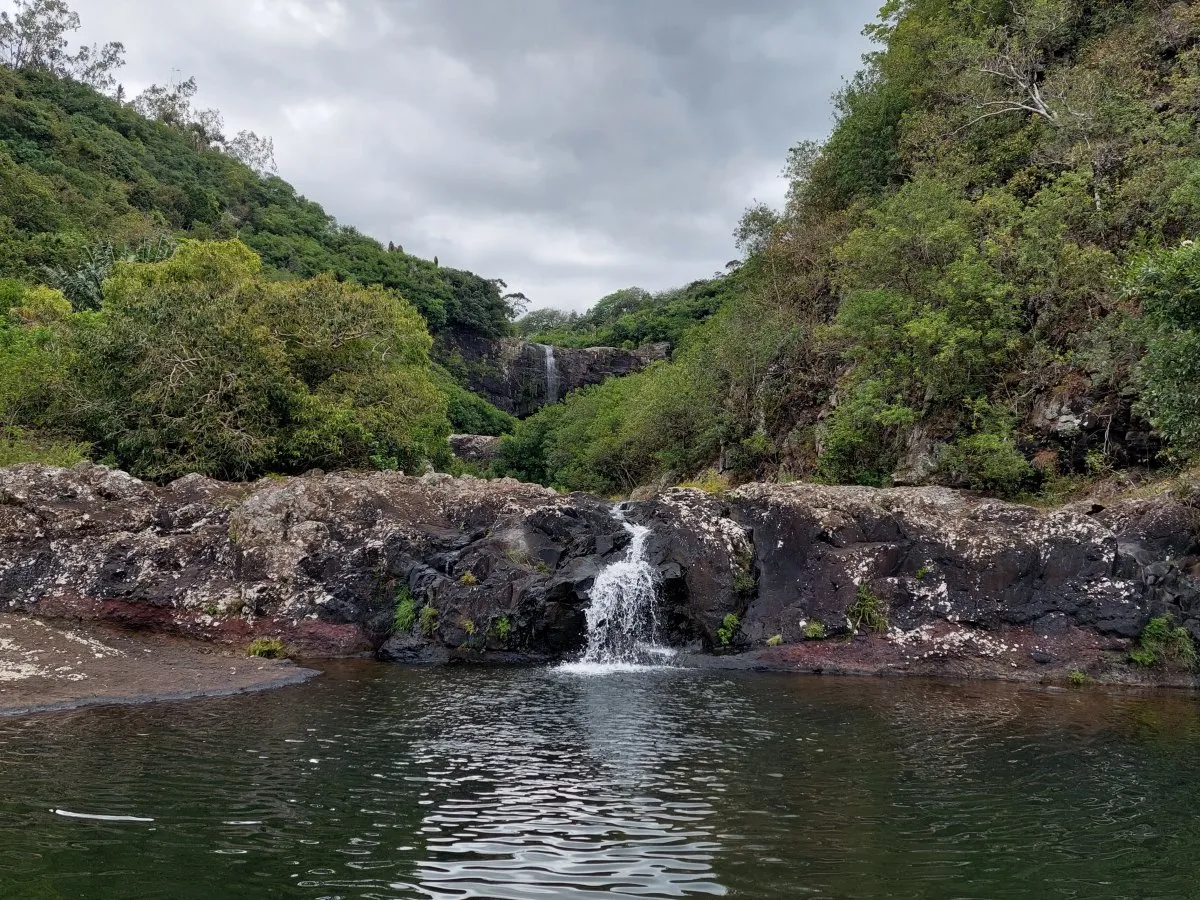 Seven cascading waterfalls surrounded by lush greenery in Mauritius at Sept Cascades