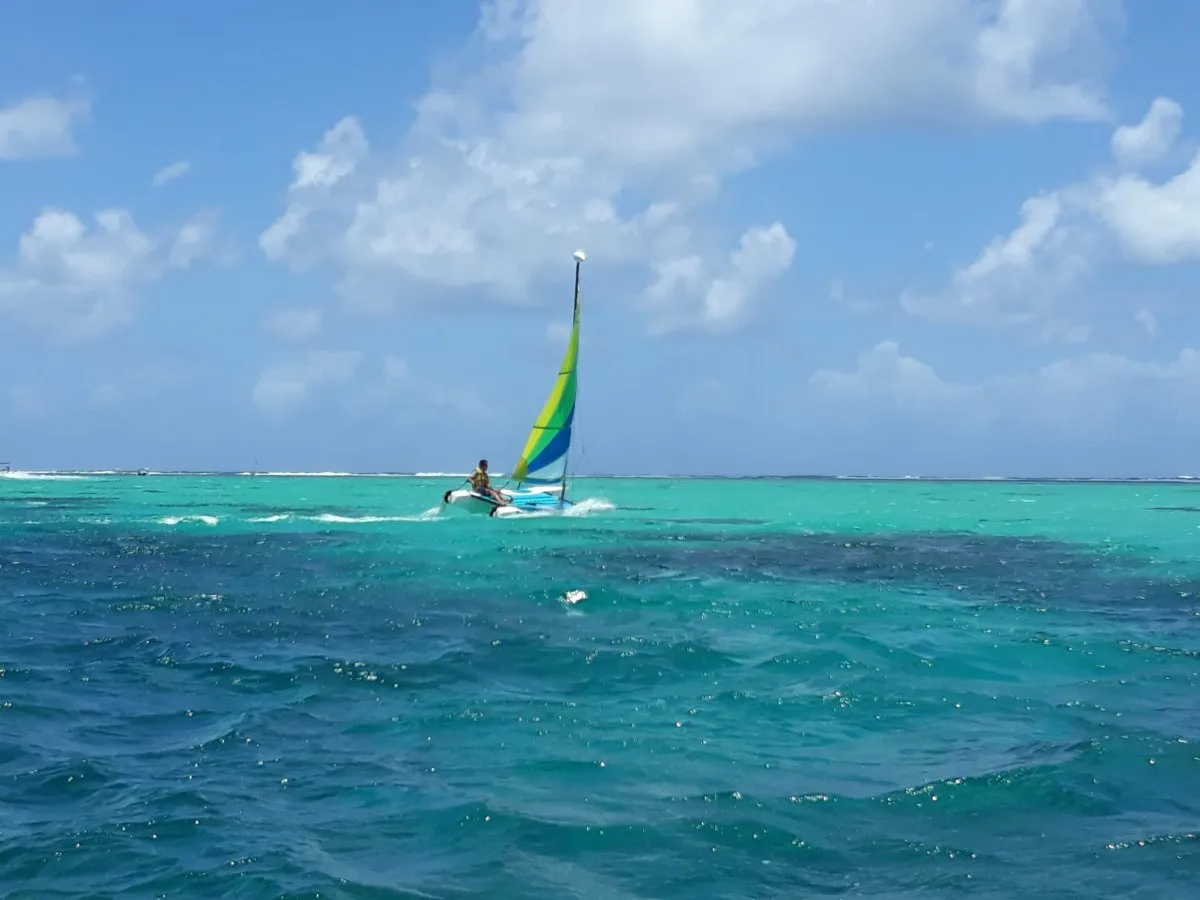 Sports catamaran sailboat sailing at Pointe d'Esny beach in Mauritius