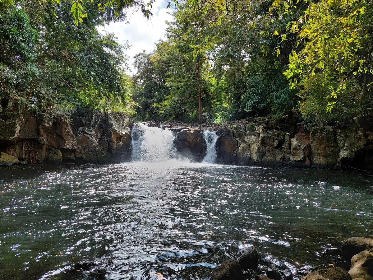 Savanne Waterfall surrounded by dense trees in Chamouny, Mauritius with flowing rivers