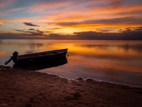 Reflection of orange clouds at Flic en Flac beach
