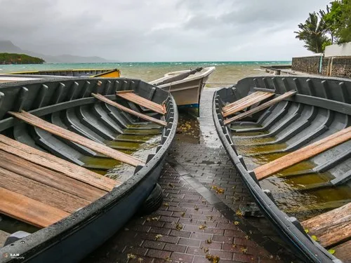Pirogues filled with rain during cyclone at Mahebourg