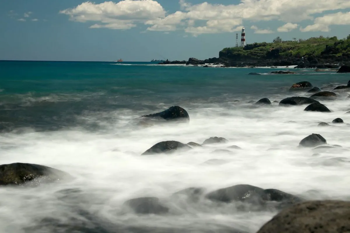 Long exposure photo of waves crashing against the rocky shore of Albion in Mauritius
