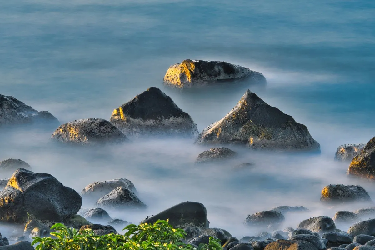 Long exposure seascape with rocks in Albion, a peaceful village in Mauritius