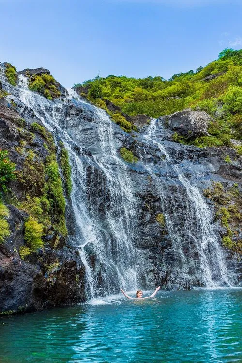 Girl enjoying a swim in lake of 7 Cascades