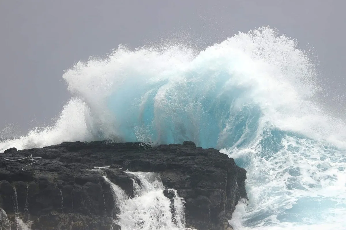 Large waves crashing onto basalt rocks at L'Escalier during Cyclone Batsirai in Mauritius