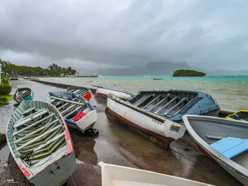 Pirogue out of the sea during Batsirai cyclone at Mahebourg waterfront