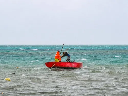 Fisherman struggling on boat during bad weather at Mahebourg