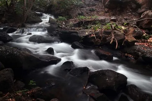 Long exposure of stream flowing through rocky river in Tamarin