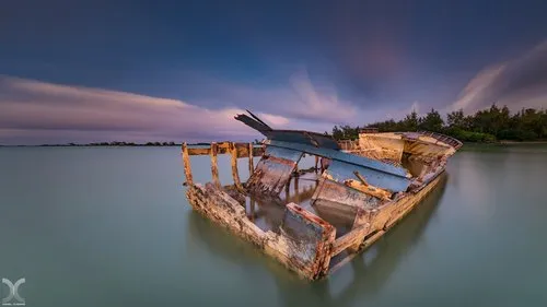 Wreck of boat at kite surf beach at Anse la Raie