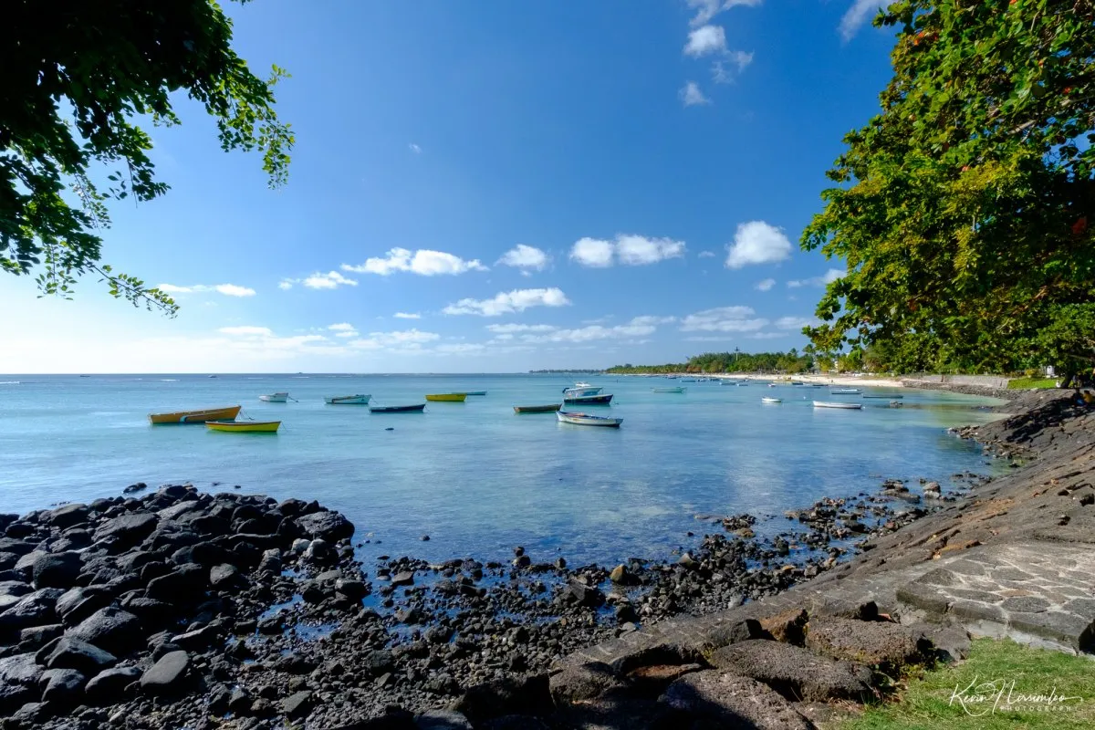 Fishing boats resting in the calm lagoon at Trou aux Biches beach in Mauritius