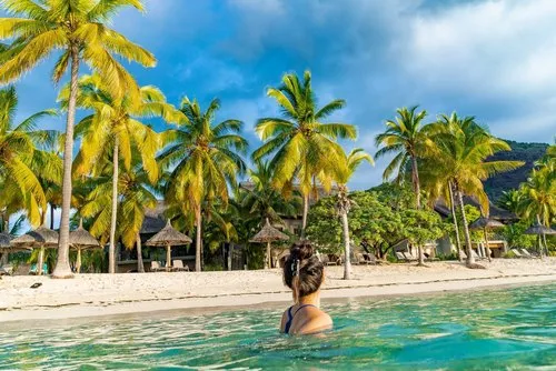 Girl swimming in Hotel sea lagoon in summer