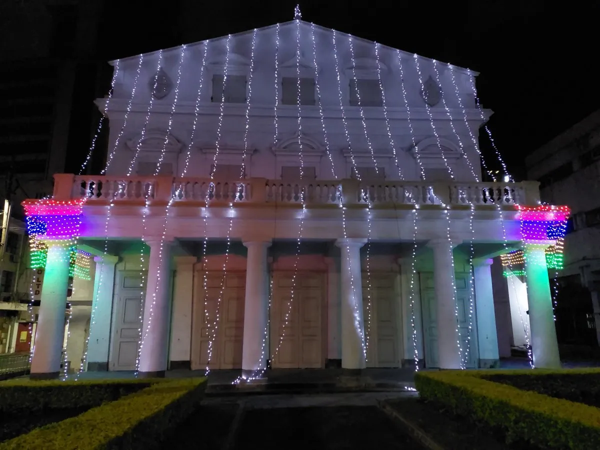 Port Louis theatre illuminated at night with decorative lights in Mauritius