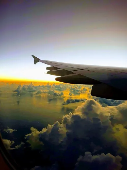 Above the clouds of Mauritius on a plane