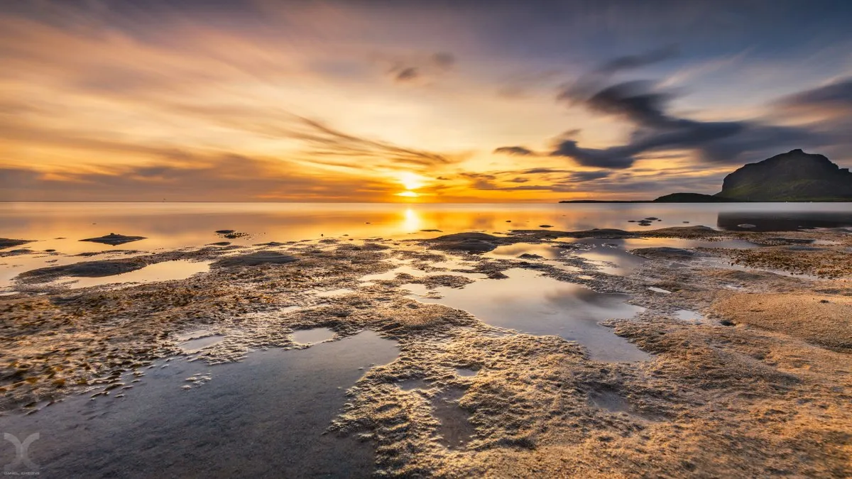 Long exposure of La Prairie sea and dramatic cloudy sky in Mauritius at sunset
