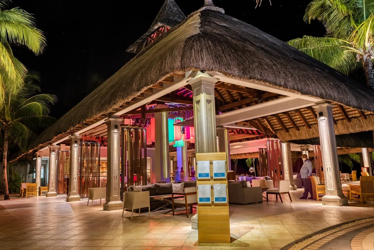 Nighttime view of a hotel bar and dance floor at a beachcomber resort in Mauritius
