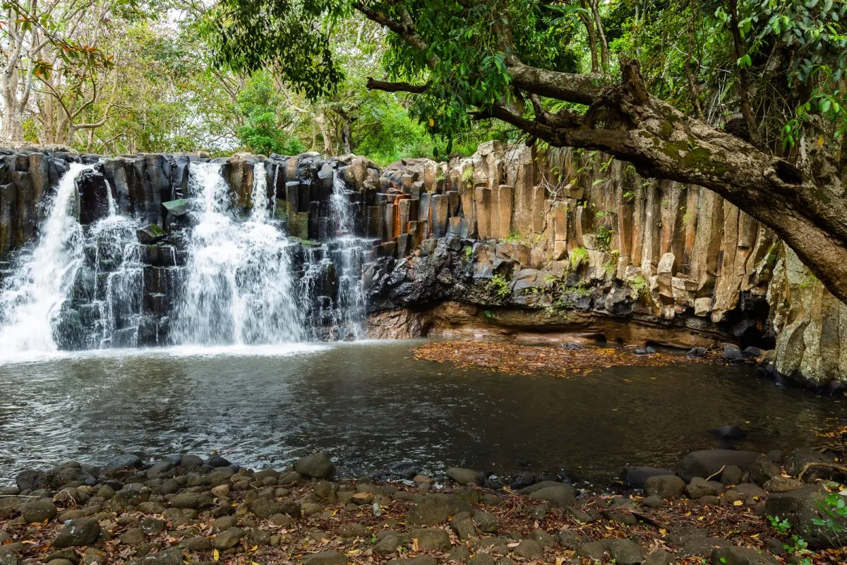 Rochester Falls in Mauritius on a calm sunny day with water splashing over rocks