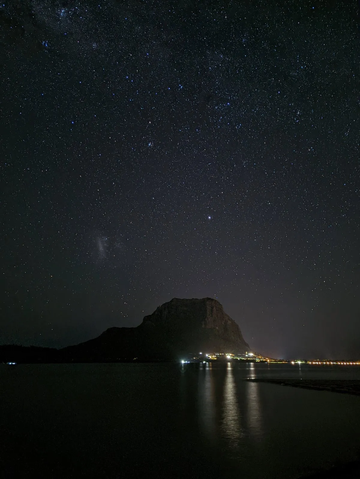 Starry night sky over Le Morne Brabant mountain in Mauritius with no clouds or moonlight