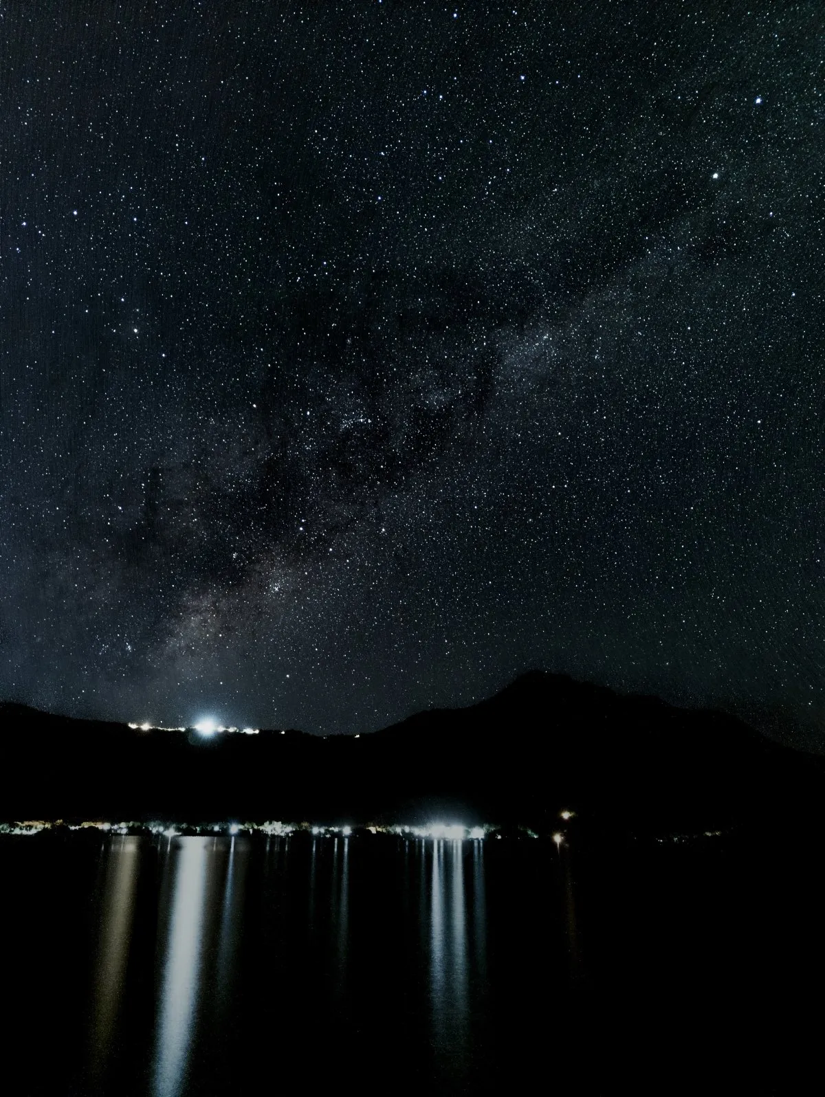 Milky Way rising over the heights of Chamarel with water reflection in Mauritius night sky