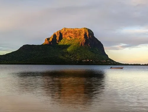Early morning scene of Le Morne Brabant & pirogue passing